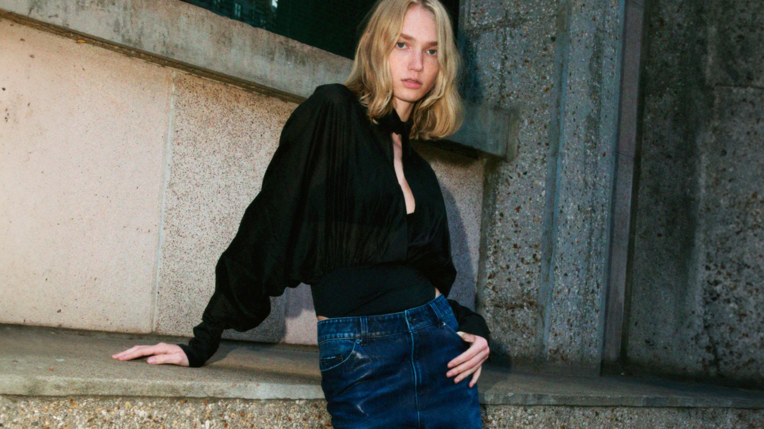 H&M jeans and pants neatly displayed in fashion retail style