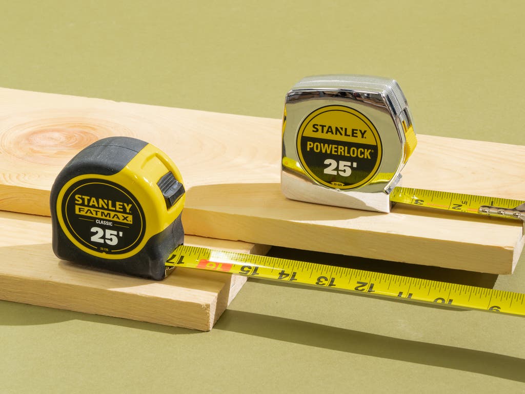 Person measuring chest with tape measure